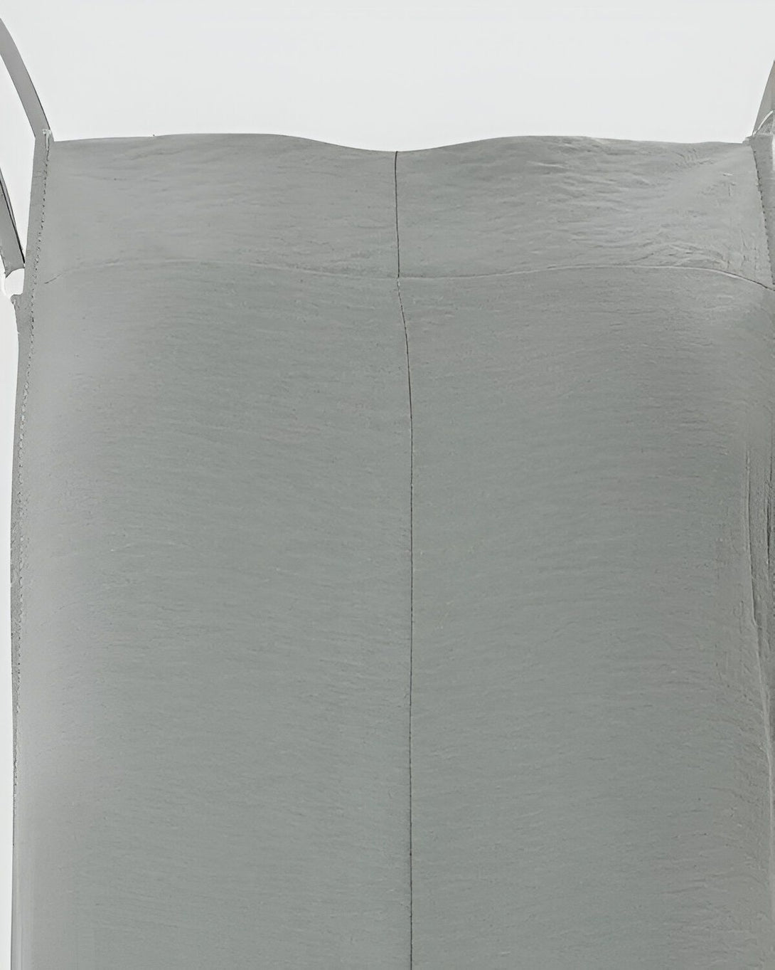 Une image d'un pantalon en toile de couleur gris clair avec des bretelles.
