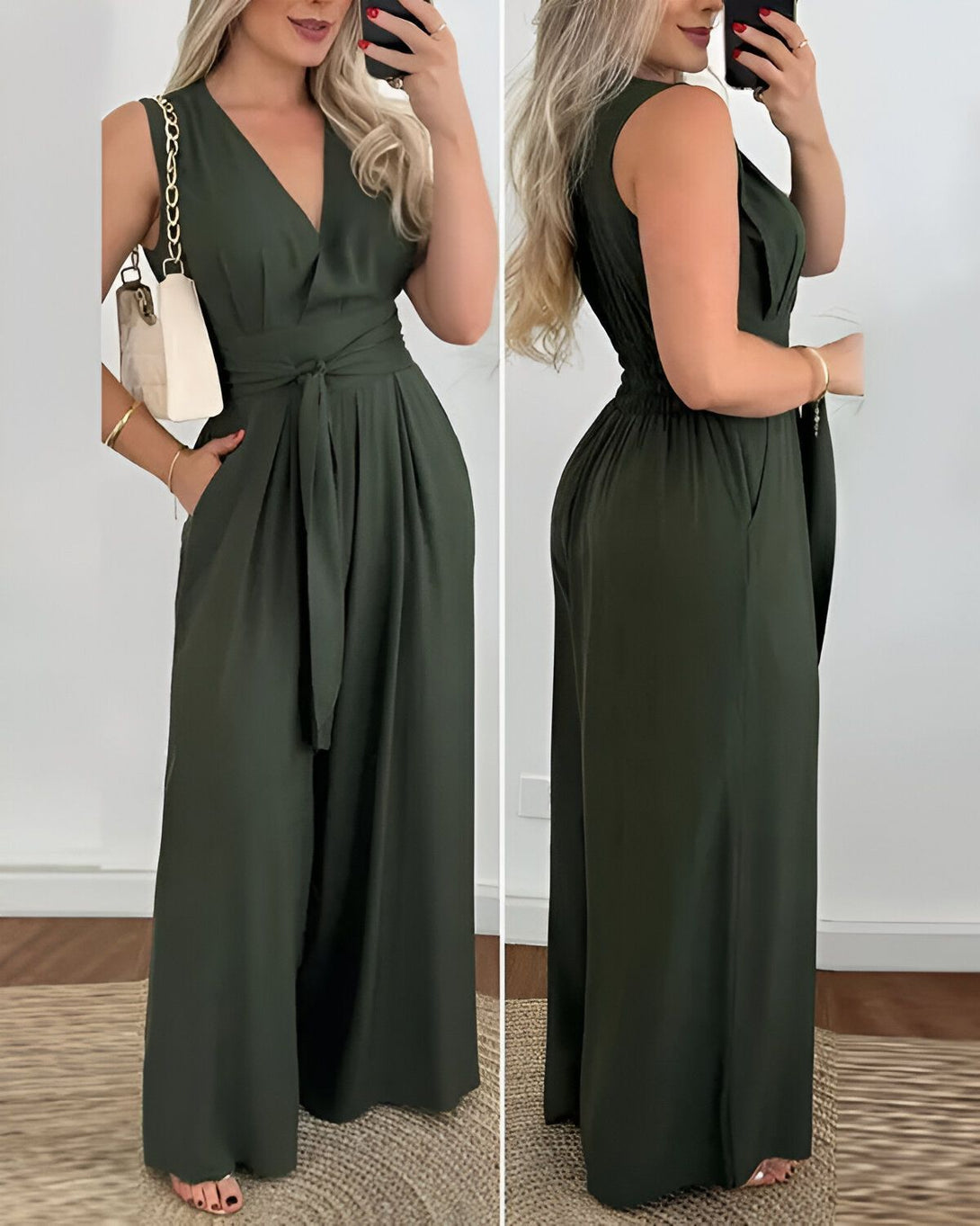 Une femme porte une combinaison-pantalon verte. La combinaison-pantalon est ample et a une ceinture à la taille. La femme a les cheveux longs et blonds. Elle porte un sac à main blanc et des sandales.