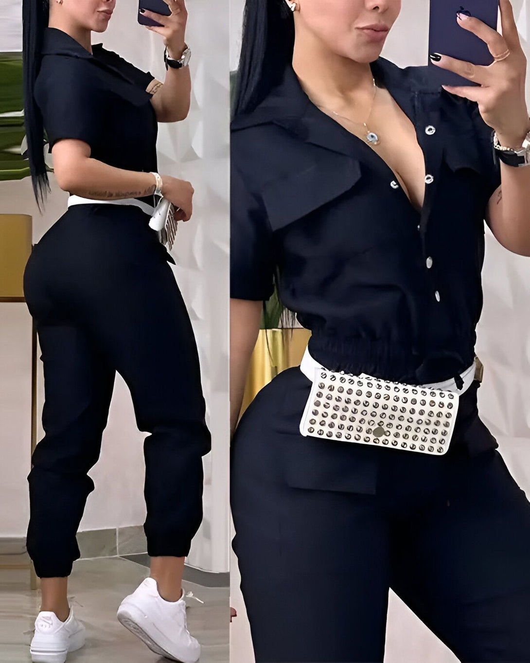 Une femme porte une combinaison noire avec une ceinture blanche. Elle est debout et prend une photo d'elle-même dans un miroir.