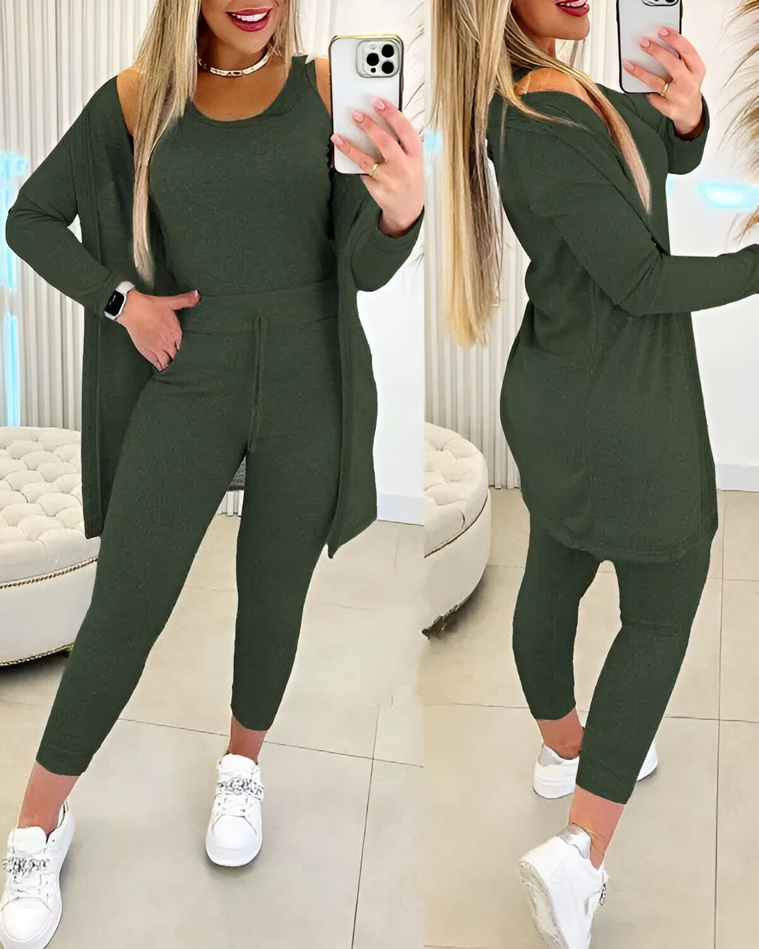 Une femme porte un ensemble trois pièces vert olive composé d'un débardeur, d'un pantalon et d'un cardigan. Elle est également chaussée de baskets blanches.