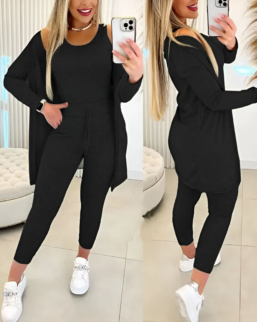 Une femme porte un ensemble trois pièces noir composé d'un débardeur, d'un pantalon et d'un cardigan. Elle est également chaussée de baskets blanches.