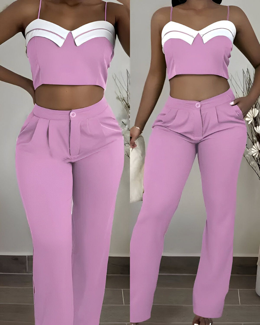 Une femme porte un ensemble pantalon et haut de couleur rose. Le haut est court et possède un col blanc. Le pantalon est taille haute et possède des poches.