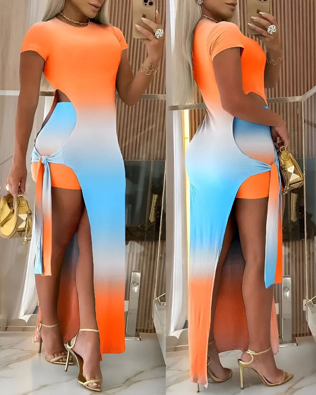 Une femme porte une robe longue orange et bleue. La robe est fendue sur le côté et nouée à la taille. Elle porte des sandales à talons hauts dorées et un sac à main doré.