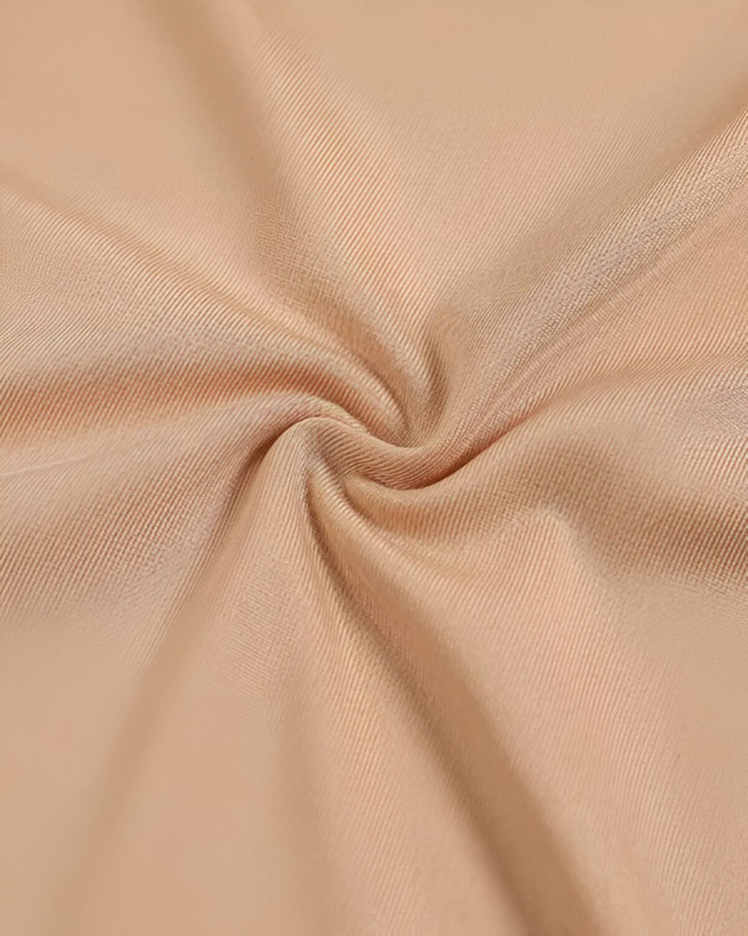 Une image de tissu beige froissé.