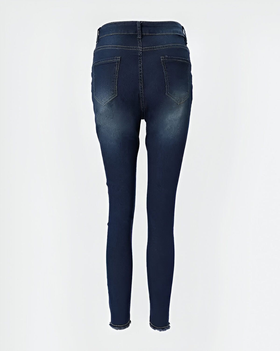Une image d'un jean moulant bleu foncé pour femme avec des déchirures au niveau des genoux.