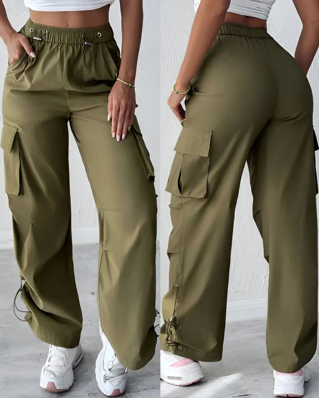 Une femme porte un pantalon cargo vert olive taille haute avec des poches sur les côtés. Le pantalon est ample et confortable.