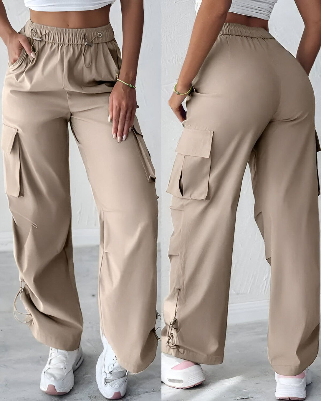 Une image d'un pantalon cargo beige porté par une femme avec un haut blanc et des baskets blanches. Le pantalon est ample et a des poches sur les côtés.
