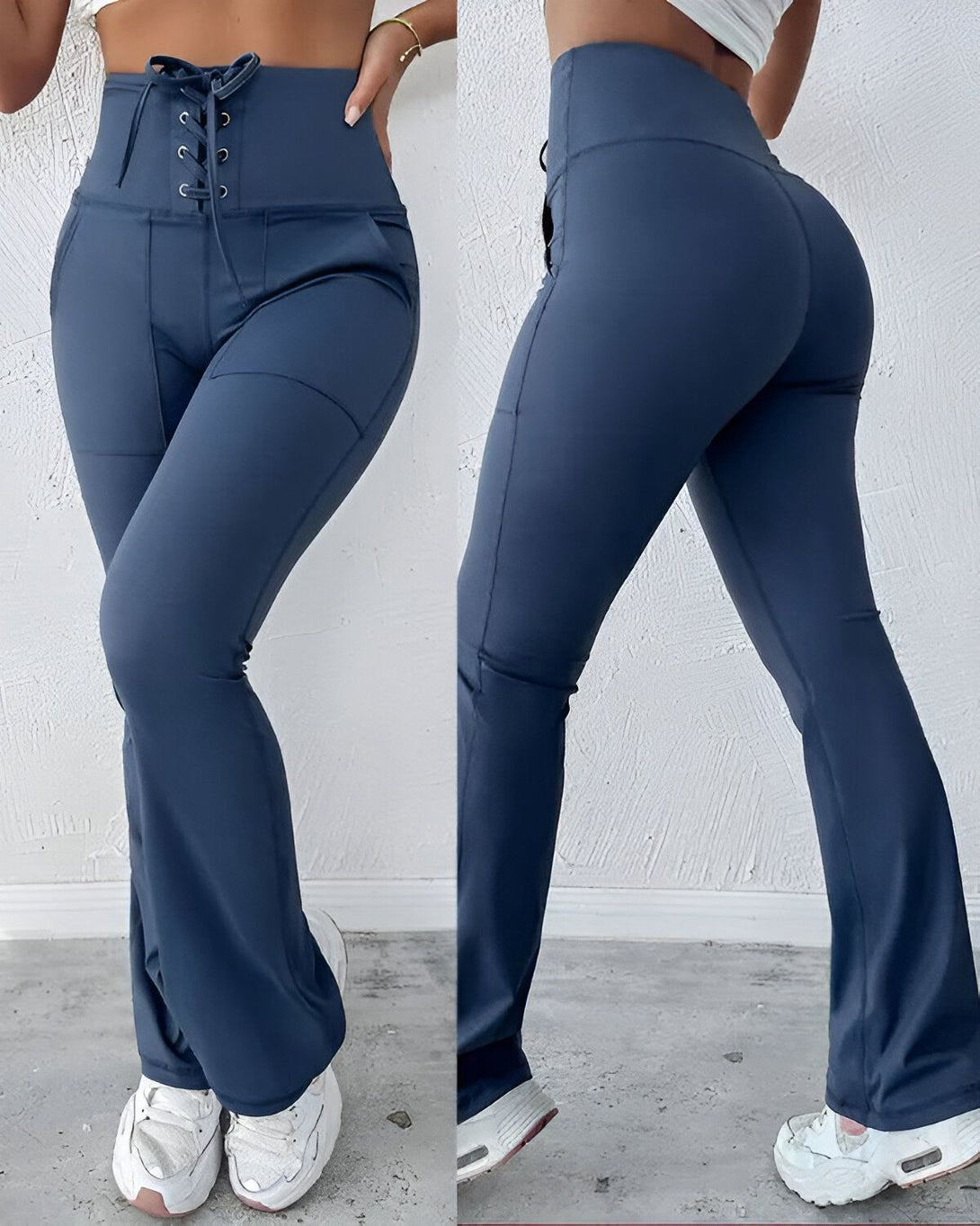 Une femme porte un pantalon de yoga bleu marine taille haute avec un laçage à la taille. Le pantalon est évasé et possède des poches.