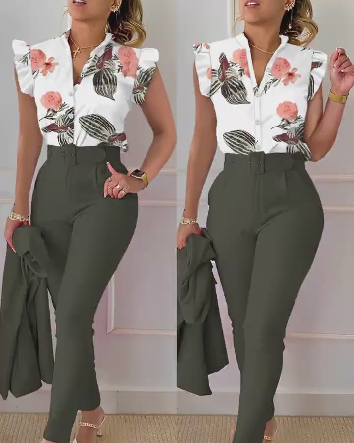 Video d'une femme portant : Ensemble haut et pantalon à manches flottantes et imprimé tropical avec ceinture