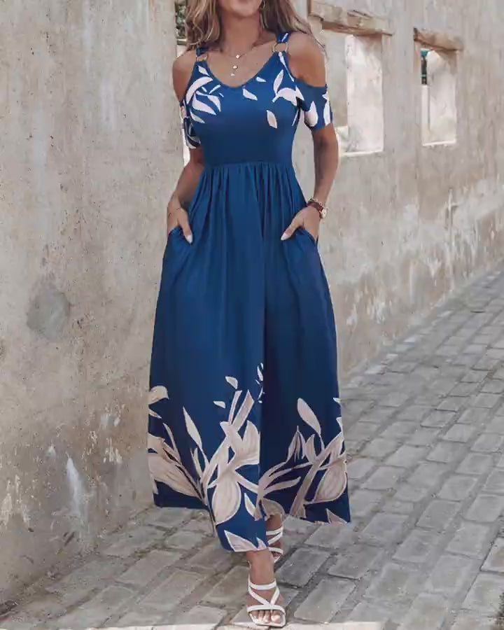 Video d'une femme portant : Robe longue à épaules dénudées et imprimé plantes