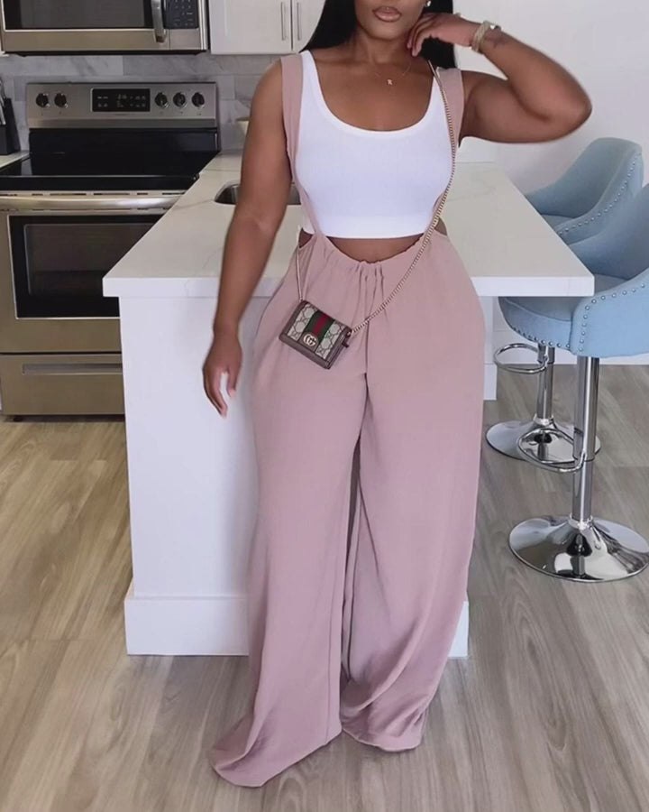 Video d'une femme portant : Combinaison à bretelles à jambe large et cordon de serrage