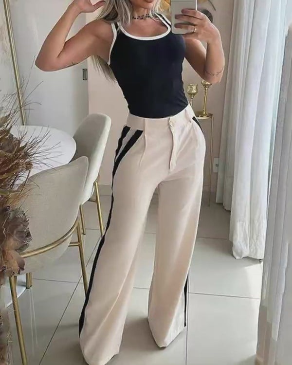 Video d'une femme portant : Ensemble débardeur à reliure contrastée et pantalon rayé