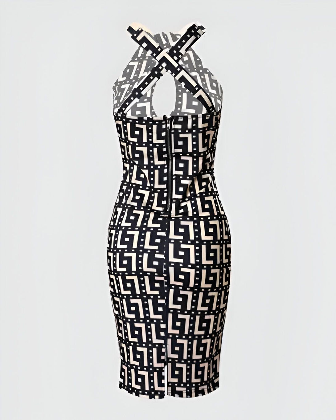 Une robe moulante noire et blanche avec un motif géométrique et un dos croisé.
