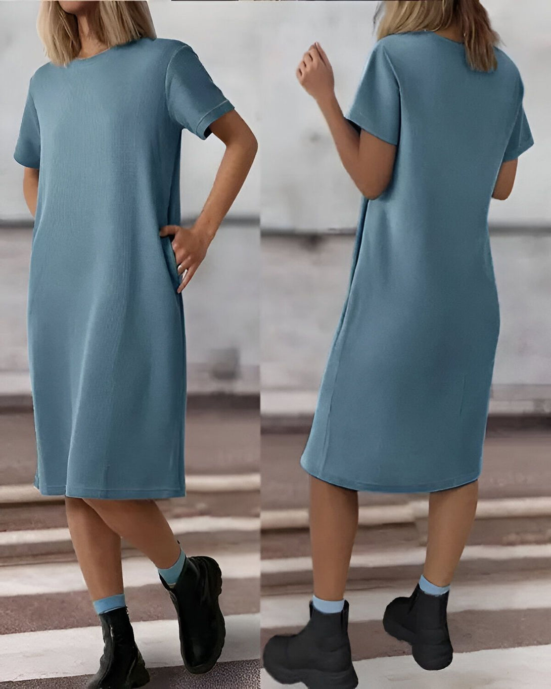 Une femme porte une robe bleu marine mi-longue à manches courtes. La robe est en jersey et possède des poches sur les côtés. Elle porte des bottines noires et des chaussettes blanches.