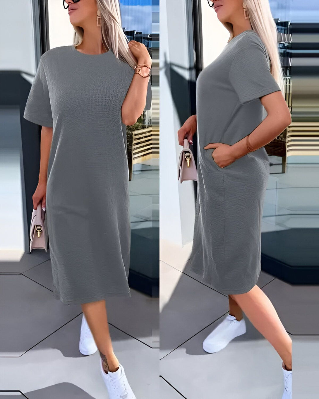 Une femme porte une robe t-shirt gris chiné mi-longue. La robe a des manches courtes et une encolure ronde. La femme porte également des baskets blanches et un sac à main beige.