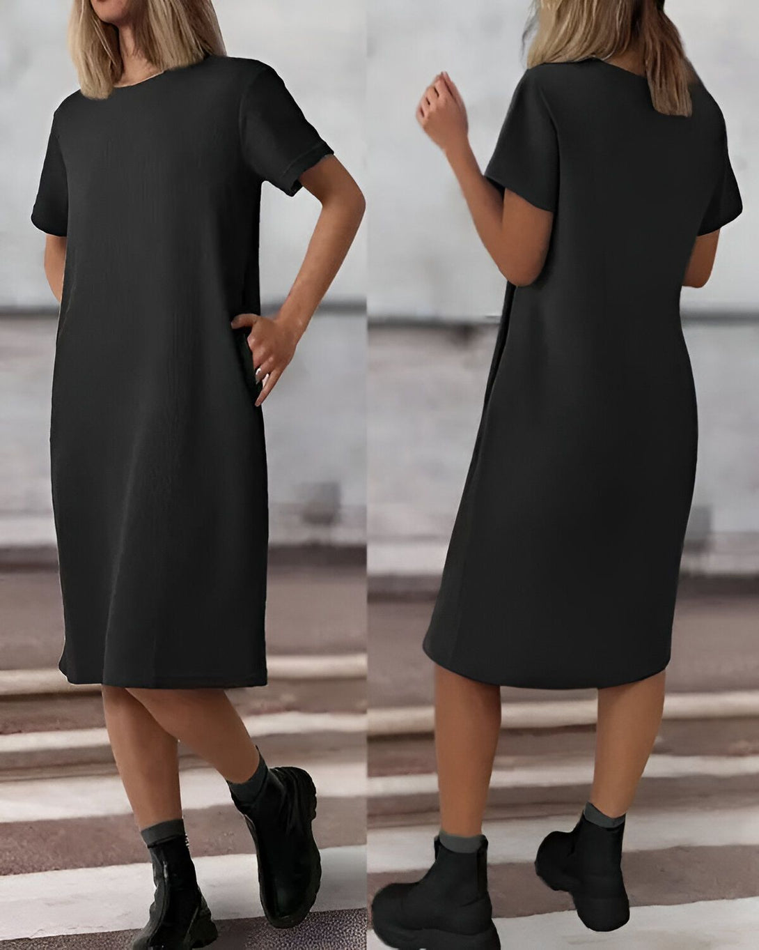 Une femme porte une robe noire mi-longue à manches courtes. La robe est droite et légèrement évasée. Elle porte des bottines noires et un sac à main noir.