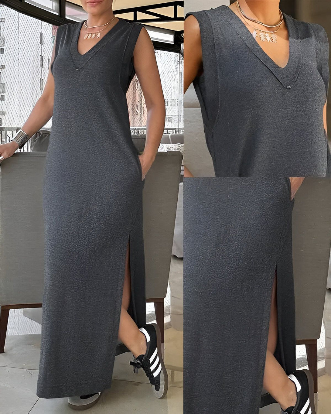 Une femme porte une robe longue en jersey gris anthracite. La robe a une encolure en V et des manches courtes. Elle est fendue sur le côté. La femme porte des baskets blanches et un collier.