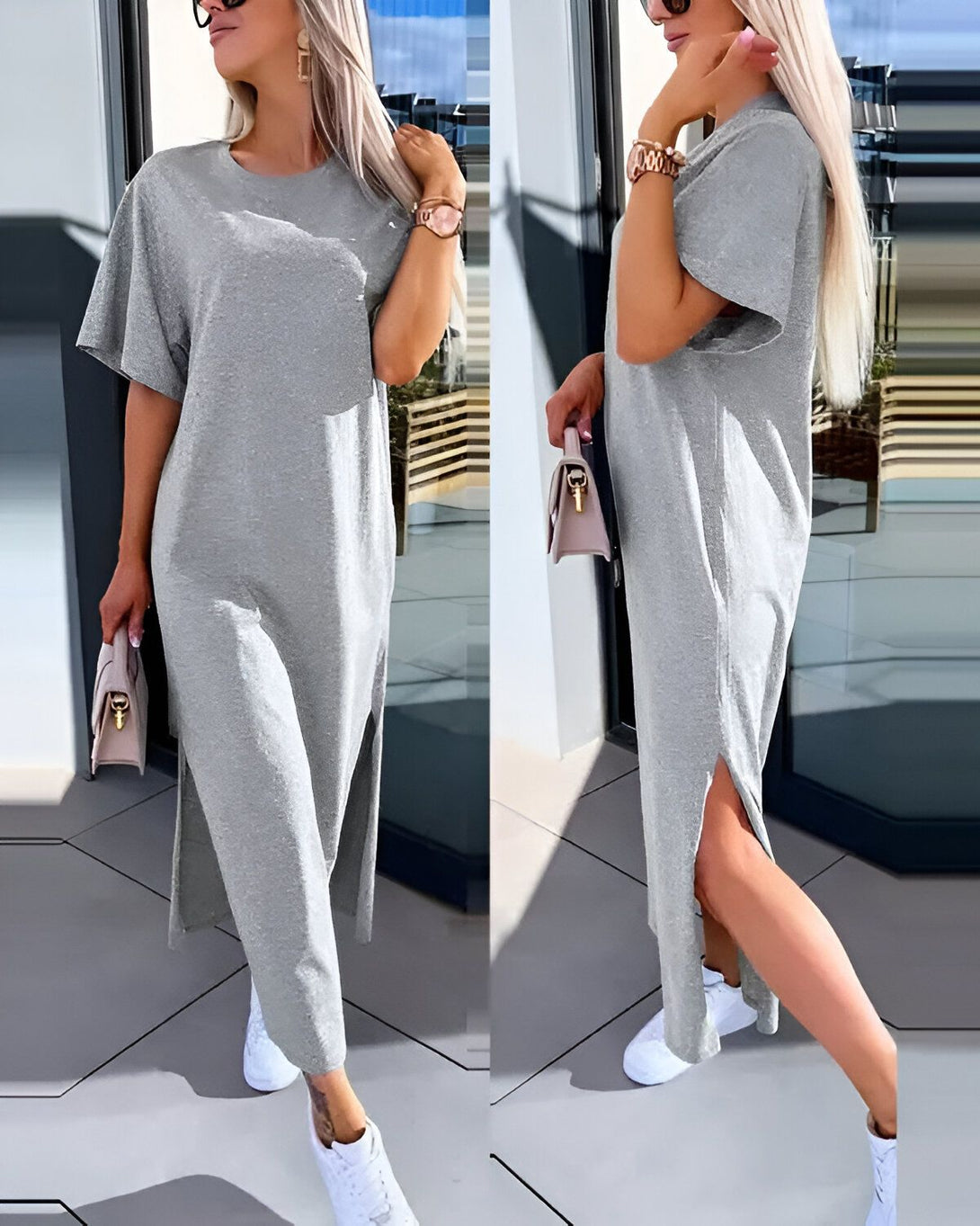 Une femme porte une robe longue en jersey gris avec des baskets blanches. La robe a des manches courtes et une fente sur le côté. La femme a un sac à main beige et des lunettes de soleil sur la tête.
