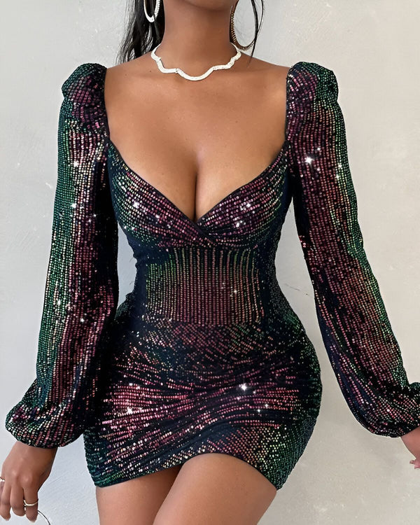 Une femme porte une robe moulante à sequins noirs avec des manches bouffantes et un décolleté plongeant.